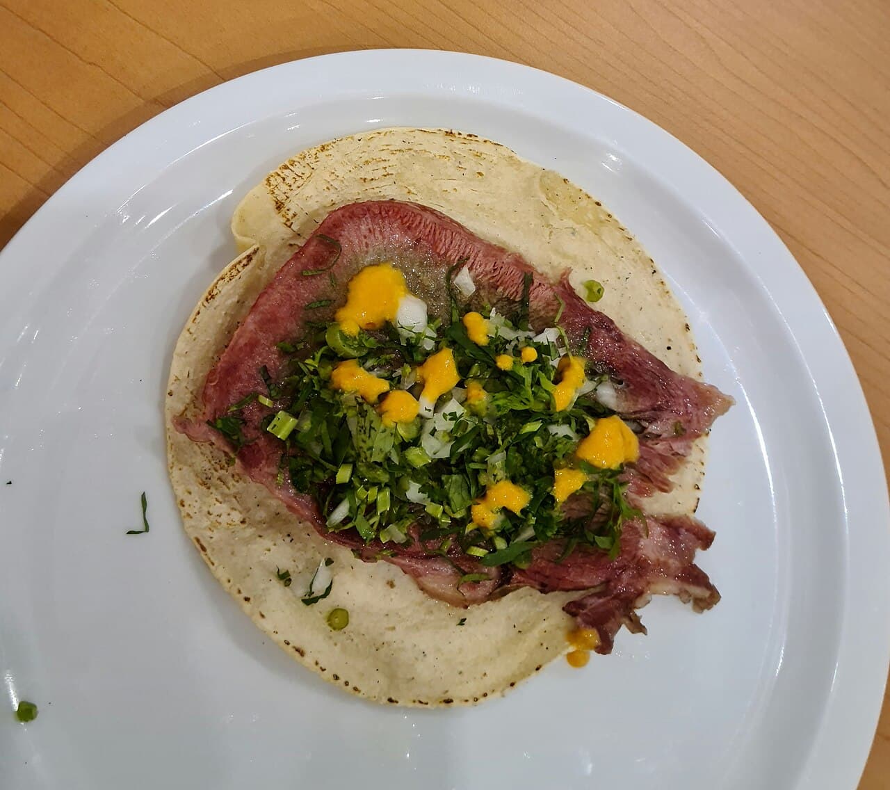 Example beef tongue taco on a plate