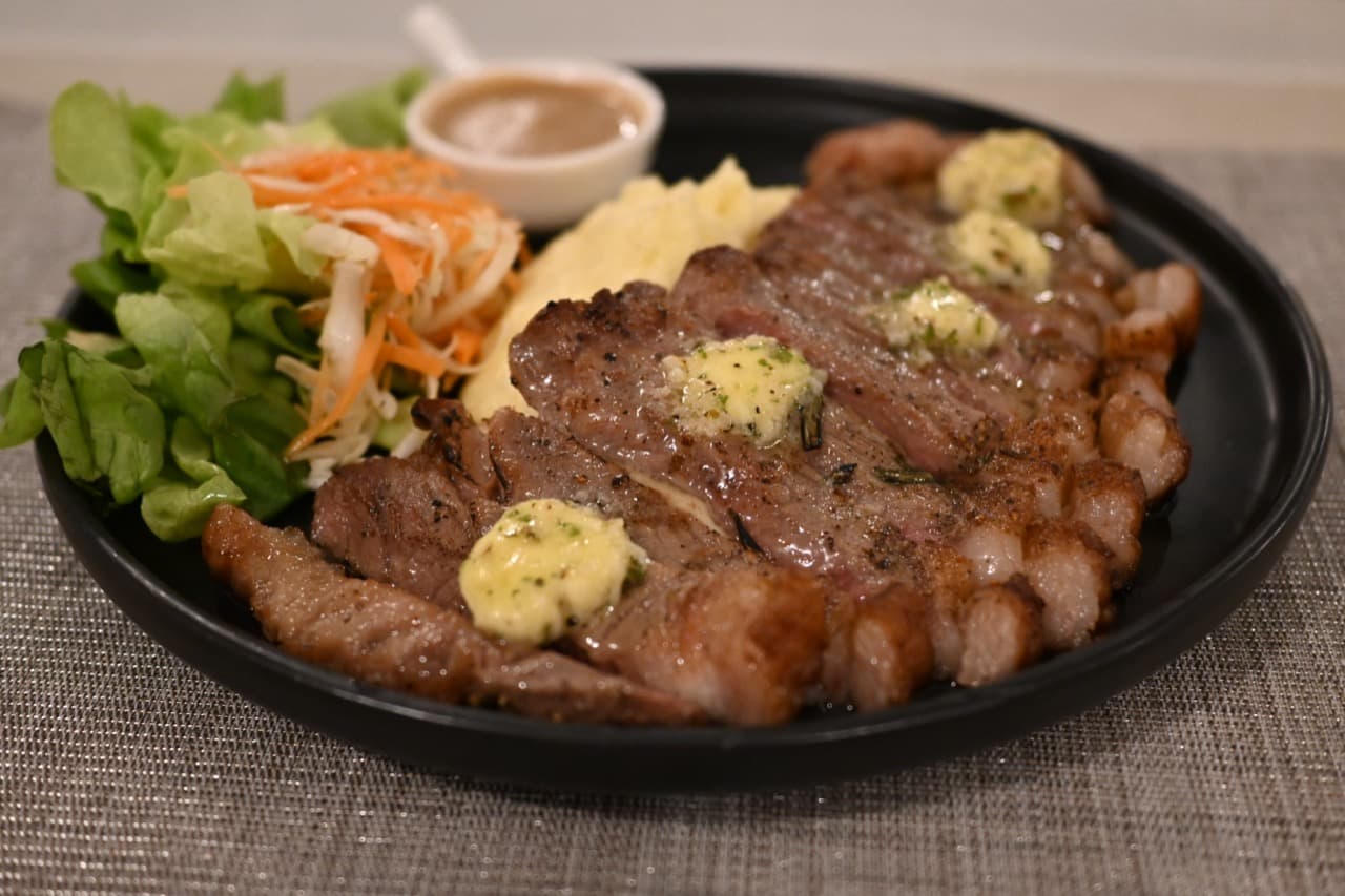 Example seared steak topped with herb butter, with mashed potatoes