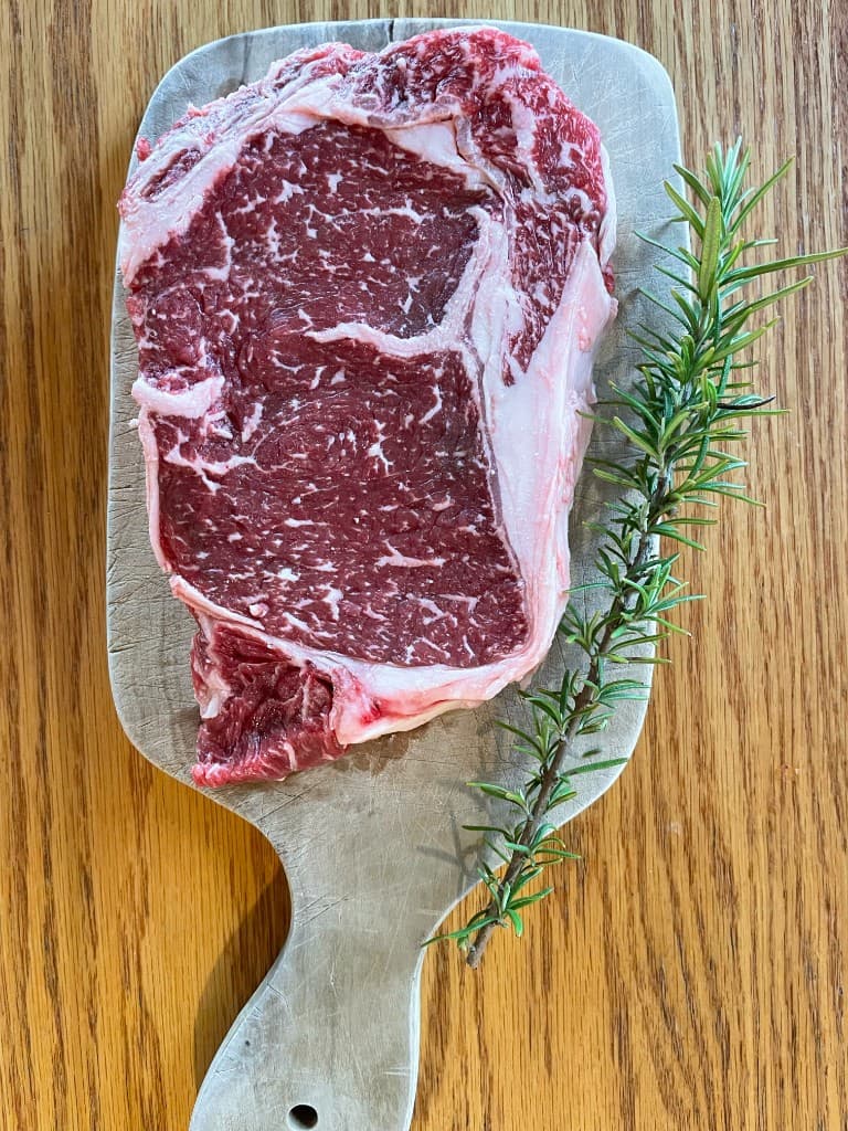 Marbled fullblood Wagyu ribeye — the finish your share is raised for